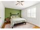 Well-lit bedroom with hardwood floors, a decorative rug, and neutral bedding at 24 Daniel Se St # 3, Atlanta, GA 30312
