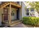 Apartment building exterior featuring private entrances, wooden stairs, and lush shrubbery at 24 Daniel Se St # 3, Atlanta, GA 30312