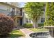 Apartment building featuring brick walkway, fountain, and lush landscaping at 24 Daniel Se St # 3, Atlanta, GA 30312