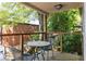 Outdoor patio with table and chairs surrounded by lush greenery and a brick wall at 24 Daniel Se St # 3, Atlanta, GA 30312
