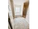 Bright bathroom with a large window, a soaking tub, and a glass-enclosed shower at 573 Emporia Loop, Mcdonough, GA 30253