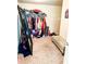 Walk-in closet with ample hanging space and shoe storage, providing organized storage solutions at 573 Emporia Loop, Mcdonough, GA 30253
