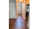 Inviting hallway with wood-look flooring and natural light from the front door at 573 Emporia Loop, Mcdonough, GA 30253