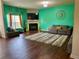 Bright living room featuring hardwood floors, a fireplace, and stylish decor at 573 Emporia Loop, Mcdonough, GA 30253