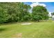 Large, well-maintained backyard featuring a fire pit and partially fenced perimeter at 7307 Banks Mill Rd, Douglasville, GA 30135