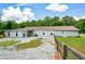 Expansive backyard featuring partial fencing and a well-maintained lawn at 7307 Banks Mill Rd, Douglasville, GA 30135
