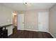 An inviting bedroom with hardwood floors and two doors, ready for your personal touch at 7307 Banks Mill Rd, Douglasville, GA 30135