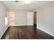 Large primary bedroom offering great space, hardwood floors and an ensuite bath at 7307 Banks Mill Rd, Douglasville, GA 30135