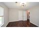 Cozy bedroom with hardwood floors, window view, and ample closet space at 7307 Banks Mill Rd, Douglasville, GA 30135