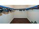 Walk-in closet providing ample storage with organized hanging rods and dark wood floors at 7307 Banks Mill Rd, Douglasville, GA 30135