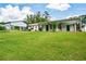 Charming home featuring a front porch, large lawn, carport and barn for additional parking and/or storage at 7307 Banks Mill Rd, Douglasville, GA 30135
