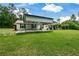 Charming home with a covered parking area and a spacious front lawn at 7307 Banks Mill Rd, Douglasville, GA 30135