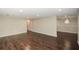 Spacious living room with hardwood floors and neutral paint, bright and inviting space at 7307 Banks Mill Rd, Douglasville, GA 30135