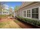 Scenic backyard view with manicured landscaping, hardscape patio, and well-maintained lawn at 1128 Bellewood Sq, Dunwoody, GA 30338