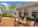 Charming brick patio surrounded by manicured landscaping, perfect for outdoor entertaining at 1128 Bellewood Sq, Dunwoody, GA 30338