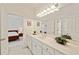 Bathroom featuring a large mirror, ample counter space, and view to bedroom, offering functionality at 1128 Bellewood Sq, Dunwoody, GA 30338
