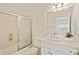 Well-lit bathroom boasting a shower-tub combo, vanity with sink, and neutral color palette at 1128 Bellewood Sq, Dunwoody, GA 30338