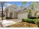 Charming home featuring an attached two-car garage and lush landscaping at 1128 Bellewood Sq, Dunwoody, GA 30338