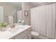 Clean bathroom with a single vanity sink and a shower with a curtain at 1382 Doublegate Ne Dr, Atlanta, GA 30319
