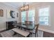 Elegant dining room featuring a rustic wooden table and bench seating with lots of natural light at 1382 Doublegate Ne Dr, Atlanta, GA 30319