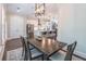 Bright dining room with modern table, decorative rug, and access to kitchen at 1382 Doublegate Ne Dr, Atlanta, GA 30319