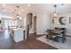 Open dining room with a dining table and bar stool seating at the kitchen island at 1382 Doublegate Ne Dr, Atlanta, GA 30319