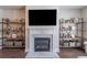 Bright fireplace with stone hearth and built-in shelving at 1382 Doublegate Ne Dr, Atlanta, GA 30319