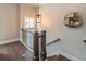 Upper level staircase landing with hardwood floors, natural light, and stylish decor at 1382 Doublegate Ne Dr, Atlanta, GA 30319
