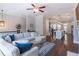 Spacious living room with an open concept view into the kitchen, beautiful floors, and a large comfortable couch at 1382 Doublegate Ne Dr, Atlanta, GA 30319