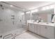 Main bathroom featuring a glass walk-in shower and double vanity sink at 1382 Doublegate Ne Dr, Atlanta, GA 30319