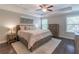 Spacious main bedroom with a tray ceiling, ceiling fan, and hardwood floors at 1382 Doublegate Ne Dr, Atlanta, GA 30319
