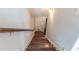 Stairway leading to a lower level, featuring hardwood steps and a handrail at 1382 Doublegate Ne Dr, Atlanta, GA 30319