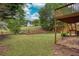 A backyard features a well-maintained lawn, a wooden deck, and mature trees providing shade at 1533 Fallen Leaf Sw Dr, Marietta, GA 30064