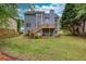 A well-manicured backyard with a wooden deck offering an outdoor living space at 1533 Fallen Leaf Sw Dr, Marietta, GA 30064