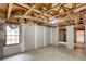 Unfinished basement with exposed beams, a concrete floor, and a window offering natural light at 1533 Fallen Leaf Sw Dr, Marietta, GA 30064