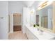 Bathroom featuring a long double vanity with modern fixtures, a large mirror, and a separate shower area at 1533 Fallen Leaf Sw Dr, Marietta, GA 30064