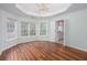Bedroom featuring hardwood floors, a trey ceiling, and natural lighting at 1533 Fallen Leaf Sw Dr, Marietta, GA 30064