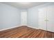 This bedroom offers hardwood floors, neutral paint, and closet space at 1533 Fallen Leaf Sw Dr, Marietta, GA 30064