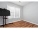 Bright bedroom features wood floors, neutral walls, and a window for natural light at 1533 Fallen Leaf Sw Dr, Marietta, GA 30064