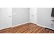 Clean bedroom featuring wood floors, neutral walls, and white doors and trim at 1533 Fallen Leaf Sw Dr, Marietta, GA 30064