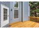 A partial view of an outdoor deck, showing the exterior of a light blue home at 1533 Fallen Leaf Sw Dr, Marietta, GA 30064
