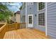 Spacious deck with wooden railing, offering a great outdoor living space, attached to a home with light blue siding at 1533 Fallen Leaf Sw Dr, Marietta, GA 30064