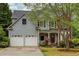Charming two-story home featuring a two-car garage, well-maintained lawn, and attractive landscaping at 1533 Fallen Leaf Sw Dr, Marietta, GA 30064