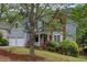 Charming two-story home featuring a two-car garage, well-maintained lawn, and attractive landscaping at 1533 Fallen Leaf Sw Dr, Marietta, GA 30064