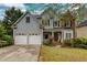Charming two-story home featuring a two-car garage, well-maintained lawn, and attractive landscaping at 1533 Fallen Leaf Sw Dr, Marietta, GA 30064