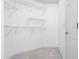 Empty walk-in closet featuring wall-mounted wire racks for storage space at 1533 Fallen Leaf Sw Dr, Marietta, GA 30064