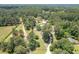 Expansive aerial view of a private estate nestled amongst lush greenery and mature trees at 204 Mt Moriah Rd, Auburn, GA 30011