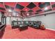 Finished basement media room with comfortable seating and unique ceiling at 204 Mt Moriah Rd, Auburn, GA 30011