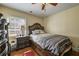 Comfortable bedroom with hardwood floors and a decorative bed frame at 204 Mt Moriah Rd, Auburn, GA 30011