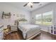 Cozy bedroom with hardwood floors, window with a view, and stuffed animals at 204 Mt Moriah Rd, Auburn, GA 30011